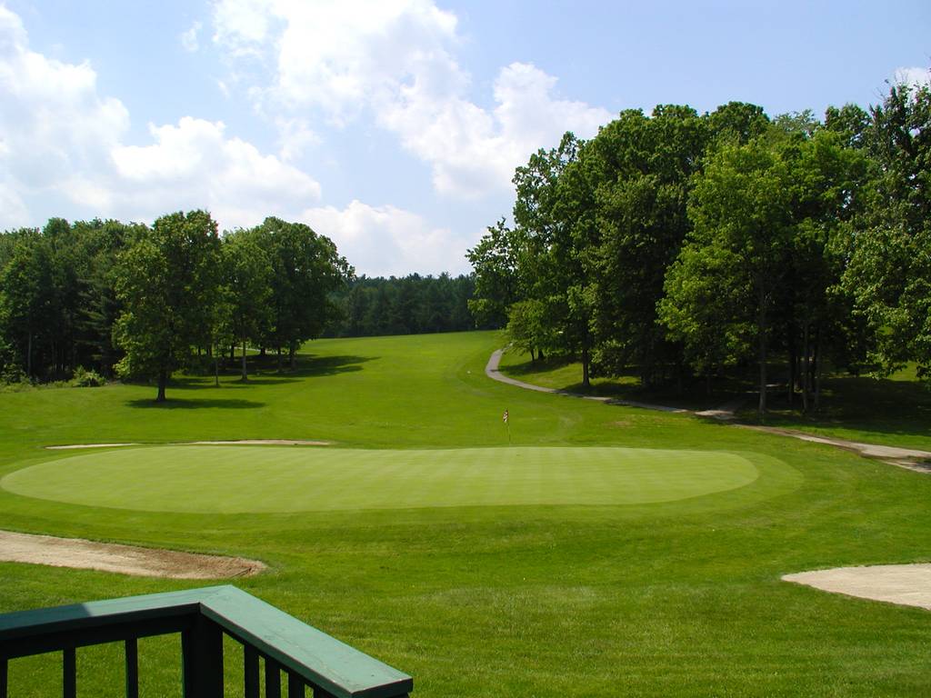 A view of a golf course from the deck.