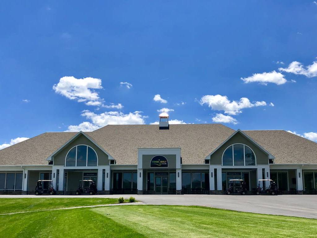 A large building with grass in front of it