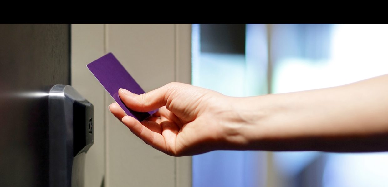 A person holding onto a purple piece of paper