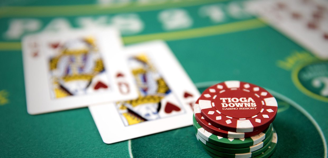 A close up of cards and chips on a table