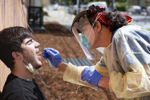 student getting tested for Covid-19 at the Tang Center