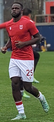 Soccer player jogging during warm-up