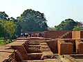 People on second story of an excavated monastery