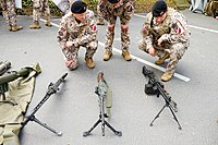 Latvian soldiers with (left to right) MG 3, FN MAG and HK21 general-purpose machine guns