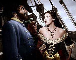 Robert Newton ja Linda Darnell elokuvassa Merirosvo Mustaparta (1952).