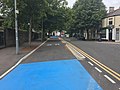 On Senghenydd Road, with blue paint indicating that cyclists have priority over the side junction.