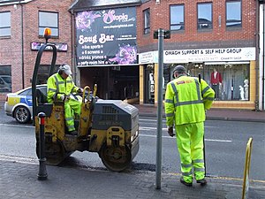 Semi-permanent pothole repair procedure—small vibratory compactor for larger repairs