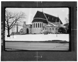 Black and white photo of the church with snowfall