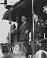 Franklin D. Roosevelt, accompanied by his son James, speaks at a 1932 whistle-stop appearance in Albany, Indiana