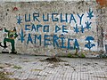 “Uruguay champion in America” in reference to the Uruguayan soccer team.