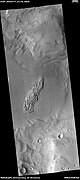 Wide view showing light-toned feature that is breaking into blocks, as seen by HiRISE under HiWish program