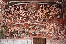 Preserved colonial wall painting of 1802 depicting Hell,[3][4][5] by Tadeo Escalante, inside the Church of San Juan Bautista in Huaro (Peru)