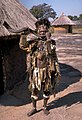 A Shona witch doctor wearing skins and beads