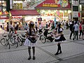 Photo of maids promoting maid cafes in Akihabara, Tokyo.