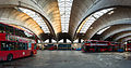 Image 10 Stockwell Garage Photograph: David Iliff An interior view of Stockwell Garage, a large bus garage in Stockwell, London, designed by Adie, Button and Partners and opened in 1952. The 393-foot-long (120 m) roof structure, seen here, is supported by ten very shallow "two-hinged" arched ribs, between which are cantilevered barrel vaults topped by large skylights. The garage, which could originally hold 200 buses, has been a Grade II* Listed Building since 1988. More selected pictures