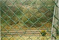 The line below Netherton signal box and Blowers Green station building in 2004.