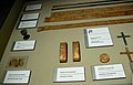 Artifacts from Clement's grave in the diocesan museum: hair, chalice, gauntlets, medallion