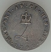 Silver coin with a design featuring a crowned numeral