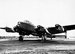 Avro Lancaster B.I (Special) of No. 617 Squadron, loaded with a 'Grand Slam' 22,000lb deep-penetration bomb, running up its engines at RAF Woodhall Spa, Lincolnshire, during 1944.