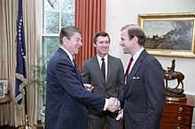 Photo of Biden shaking hands with Reagan in the Oval Office.