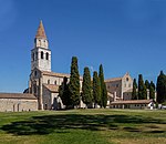 Church in stone and a baptistery