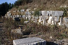 Terrace wall of Octavian's campsite memorial, with cuttings for ship's rams