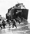 Australian 24th Infantry Brigade landing from USS LST-560 on Maeda-shima, 10 June 1945