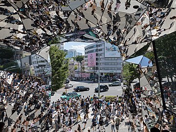 Street crowd reflecting in the polyhedral mirrors of the station Tokyu Plaza Omotesando, Harajuku, Tokyo, Japan