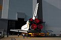 Endeavour, atop the transporter, moves into the Vehicle Assembly Building to be stacked with the External tank and SRBs.