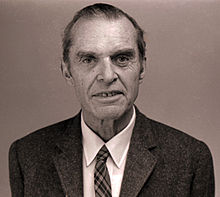 Head and shoulders of elderly man in suit and tie