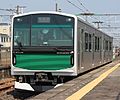 Set V1 running under overhead wires on the Tohoku Line in March 2014