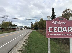 Cedar welcome sign along East Bellinger Road