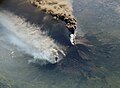 Image 62An October 2002 eruption of Mount Etna, a volcano on the Italian island of Sicily, as seen from the International Space Station. Etna is the largest of Italy's three active volcanoes and one of the most active in the whole entire world. This eruption, one of Etna's most vigorous in years, was triggered by a series of earthquakes. Ashfall was reported as far away as Libya, 600 km (373 mi) to the south. (Credit: Expedition 5 crew.) (from Portal:Earth sciences/Selected pictures)