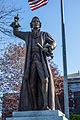 Bronze sculpture of James Otis, Jr stands to the left of the courthouse entrance