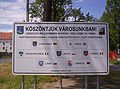 Sign showing twin towns of Pápa, Hungary