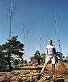 A young woman wearing t-shirt and shorts at the warm summer in Åland