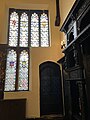 The hall: stained glass windows on east wall above the door and south end of hall.