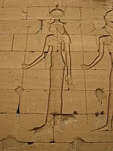 Relief of a woman in Egyptian clothing with an elaborate headdress