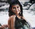 Girl from Papua New Guinea with a dog.