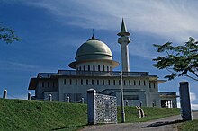 A building with a dome and turret