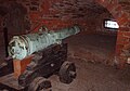 The basement with a 17th-century cannon.