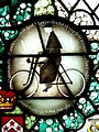 Stained glass roundel of "Canon Walter Herbert Marcon on his Bike" in the church