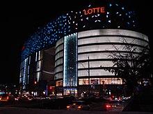 Exterior of a modern urban store at night