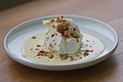 A floating island is a dessert consisting of meringue floating on crème anglaise.