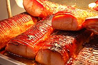 Canadian bacon, or peameal bacon, prepared from center-cut boneless pork loin