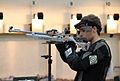 Competitor resting between shots during an ISSF competition