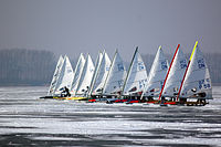 International DN class iceboats at the start of a race in Znin, Poland