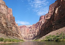 View of a steep-sided canyon from river level