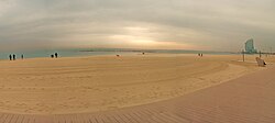 Barceloneta beach in winter, with W Barcelona Hotel