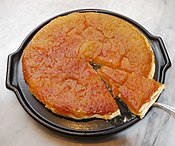 Tarte Tatin is an upside-down tart in which the fruit (mostly apples) are caramelized in butter and sugar before the tart is baked.